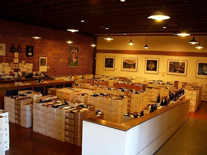Kermit Lynch Wine Merchant in Berkeley, where collectors build purchase history to access Rhône Valley allocations.