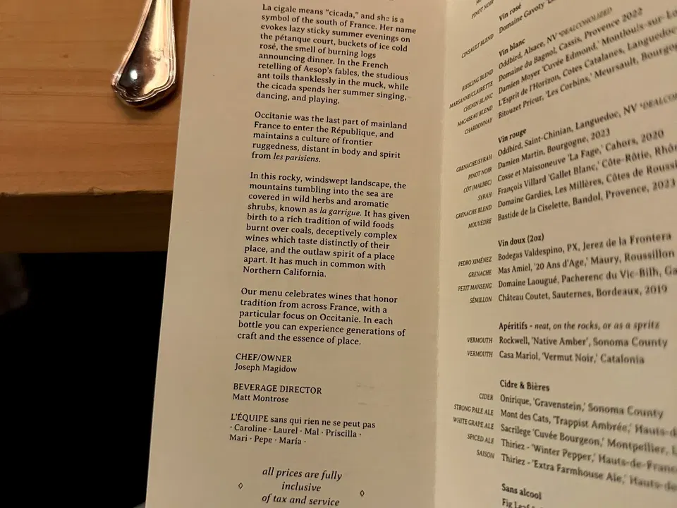 La Cigale’s French wine booklet opened across the counter