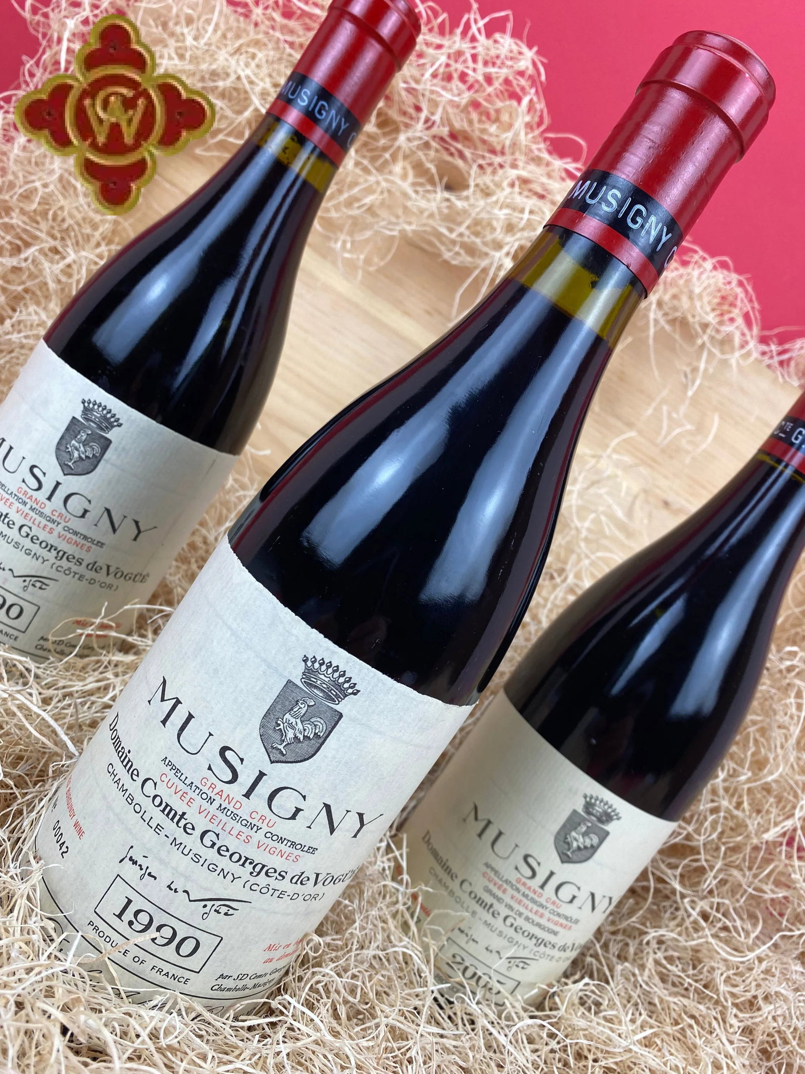 Domaine Comte Georges de Vogüé bottles feature striking red foil caps.