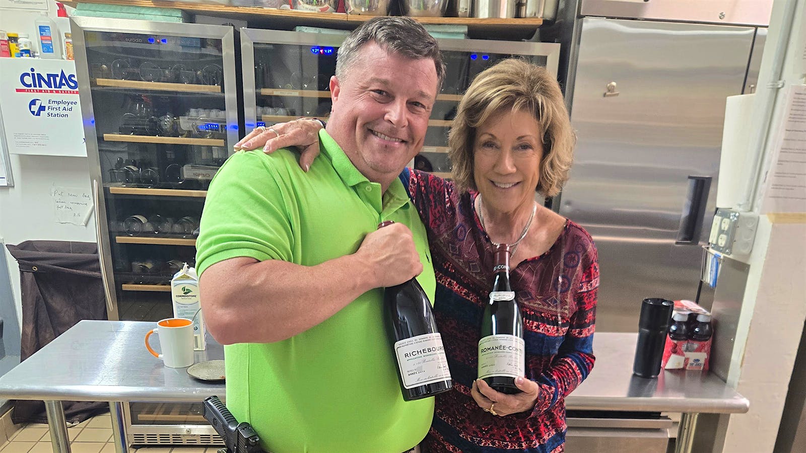 The L'Auberge Provençale wine theft: The recovered bottles are held by two individuals.