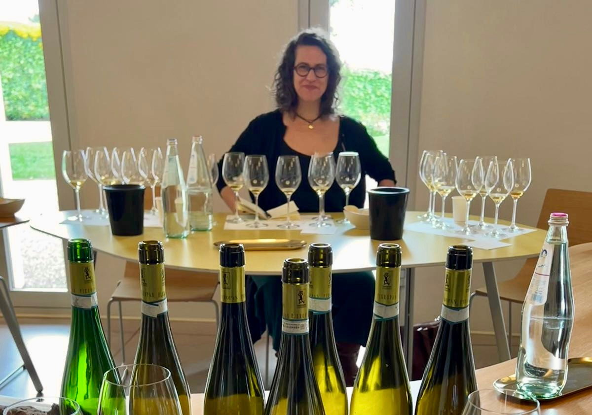 A Wine Scholar Guild Champagne Masters co-instructor leads a professional wine education tasting session.
