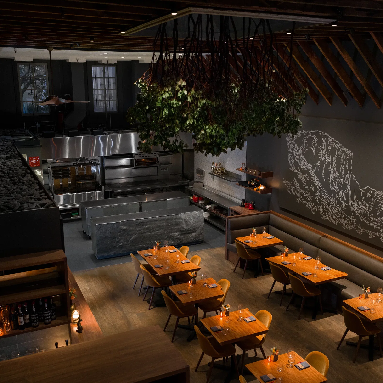 Lazy Bear and Bay Area Wine Culture features a striking overhead installation of lush green foliage.