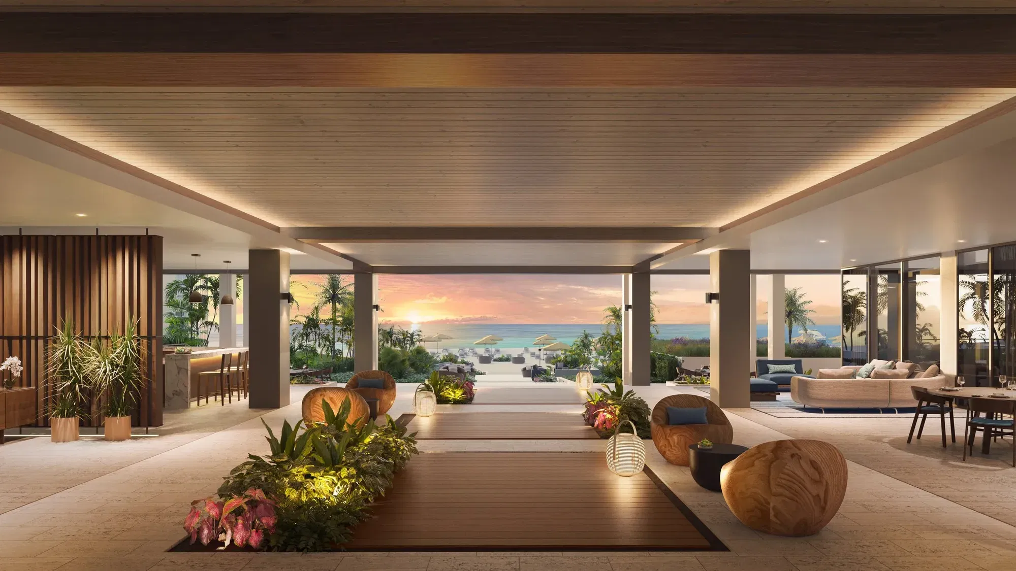 A luxurious, open-plan lobby of the Waldorf Astoria Miami Beach, featuring wooden ceilings, lush indoor plants, and a view of the ocean at sunset.