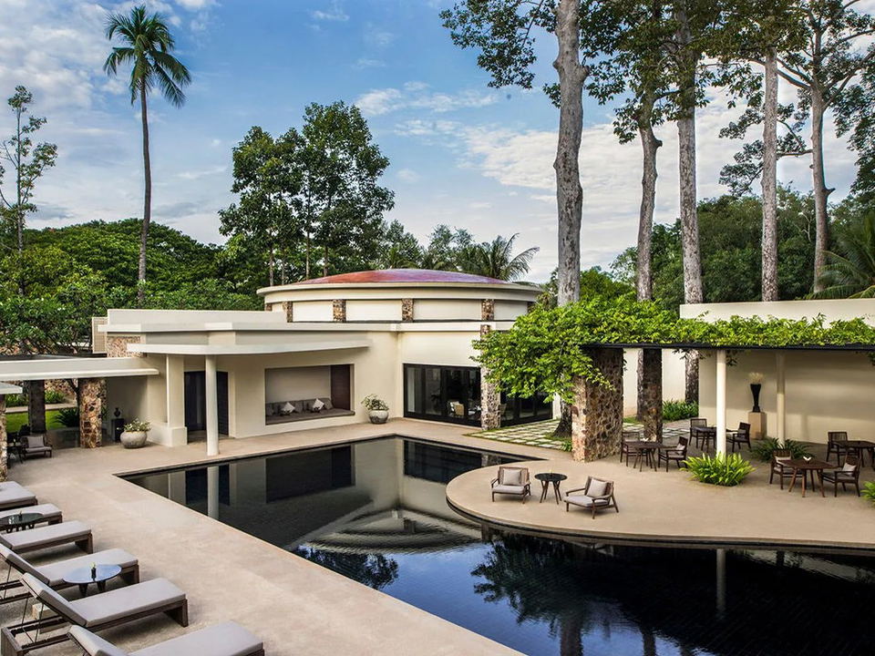 Amansara's circular pool and walled garden courtyard, a defining architectural feature of this luxury hotel in Cambodia.