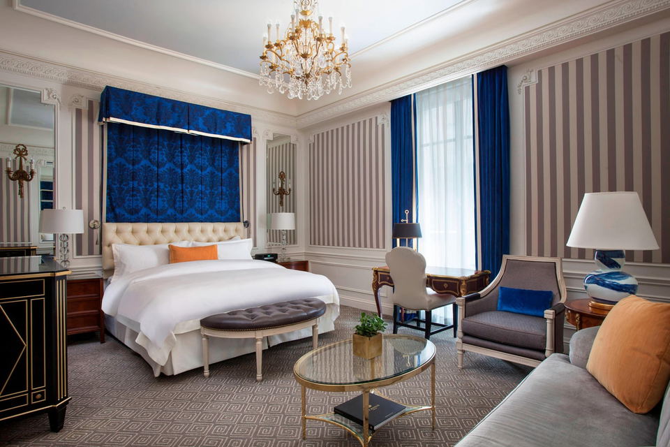 St. Regis New York luxury suite interior bedroom with classic butler-service luxury and formal furnishings.