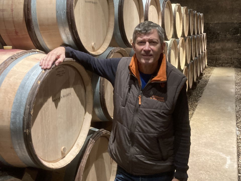 Christophe Roumier among the Bonnes-Mares barrels in the Domaine Georges Roumier cellar (via The Fine Wine Review)