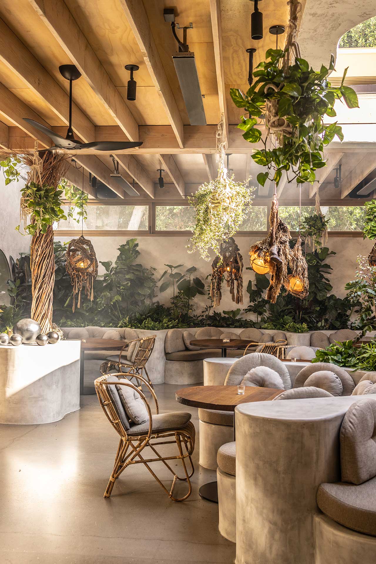Private Dining Options at Meteora features lush hanging greenery creating a vibrant, natural ambiance.