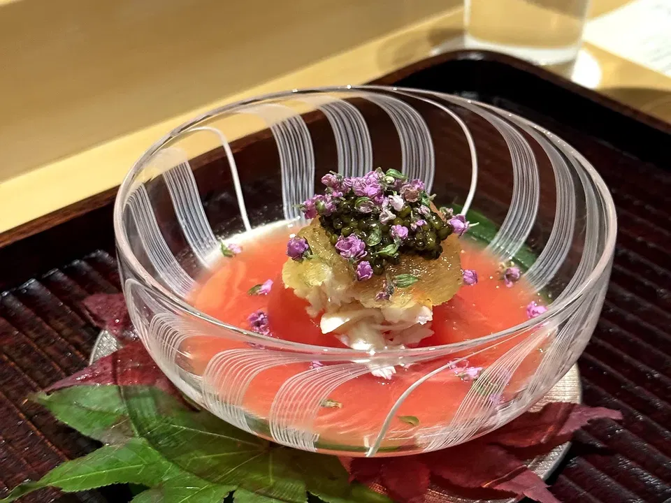 King crab with tomato, sudachi jelly and caviar in a fluted glass bowl at Muku