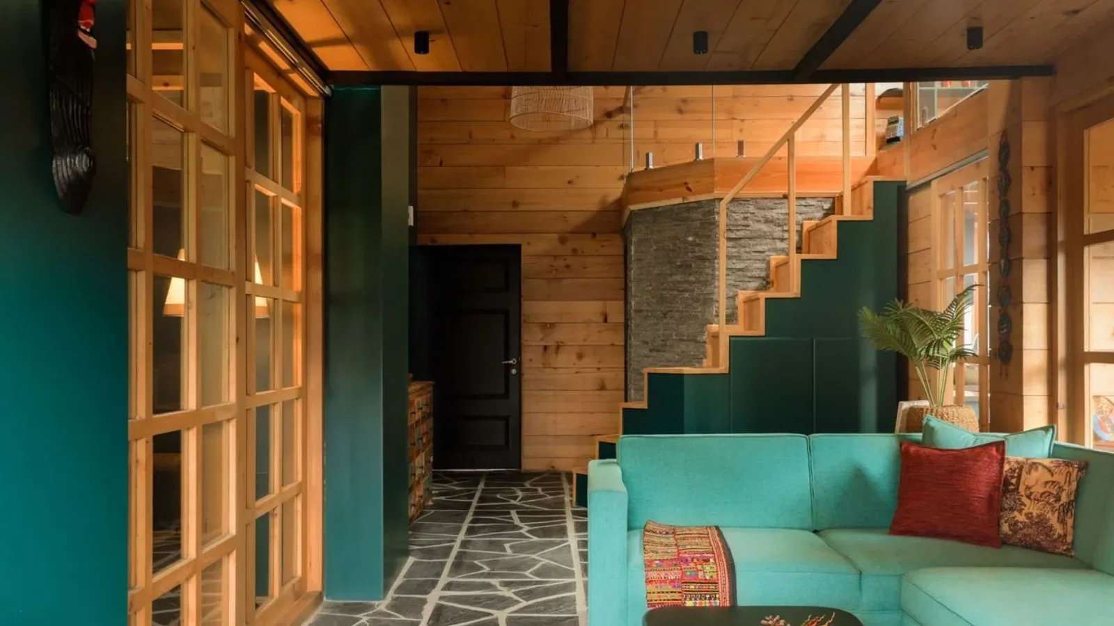 5. Unique Features, showcasing a vibrant teal sectional sofa that adds a pop of color.