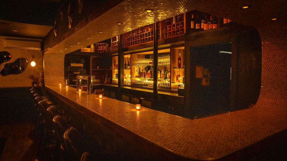 Uptown Social (South End/Roxbury) features a distinctive, textured golden bar top.
