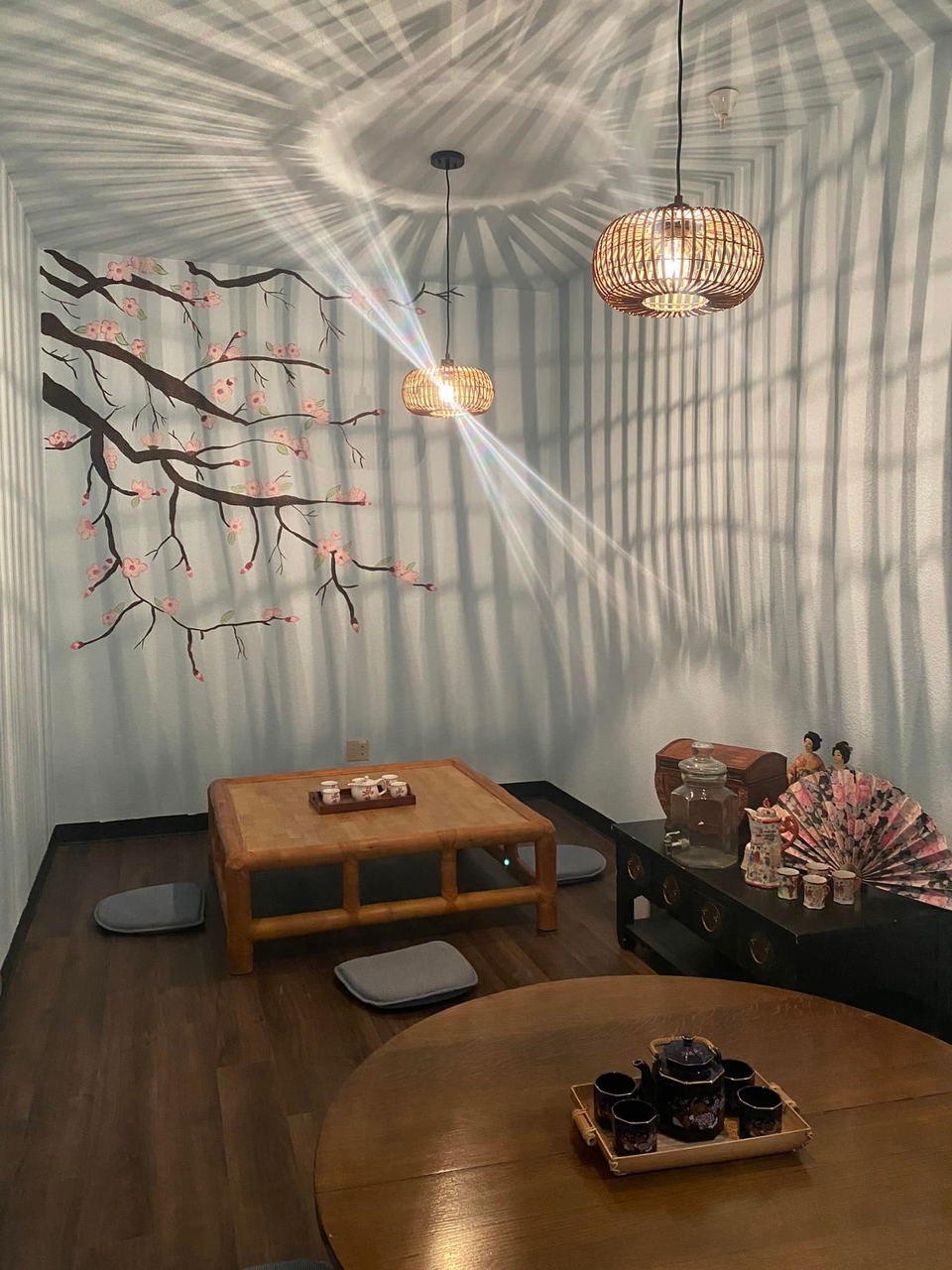 Nana's Green Tea (Pasadena) features charming woven light fixtures casting unique shadows on the walls.