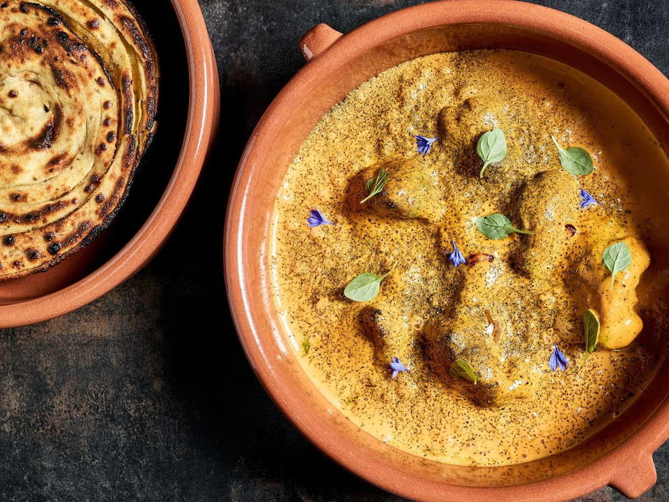 Brick Lane Arts District: A rich golden curry and charred flatbreads.