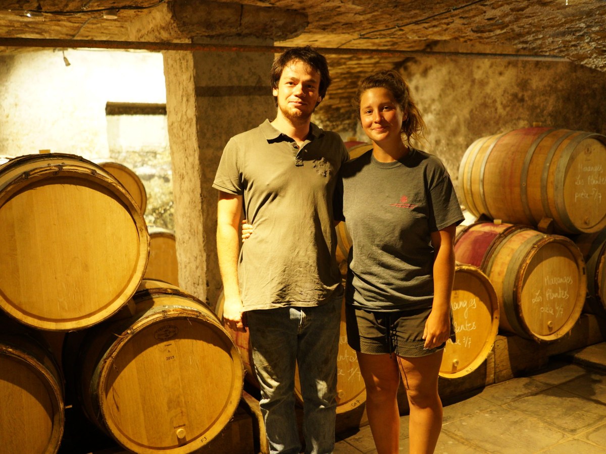 Hugo Mathurin and Talloulah Dubourg at Domaine de Cassiopée, surrounded by their aging barrels.