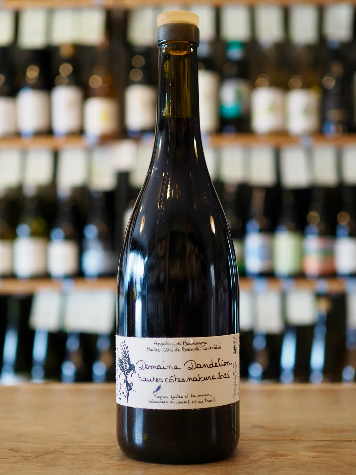 Domaine Dandelion (Hautes-Côtes de Beaune) features a distinctive bird illustration on its label.