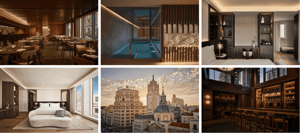 An upscale bar interior with warm wood cabinetry, ambient lighting, and large windows overlooking a cityscape with historic buildings.