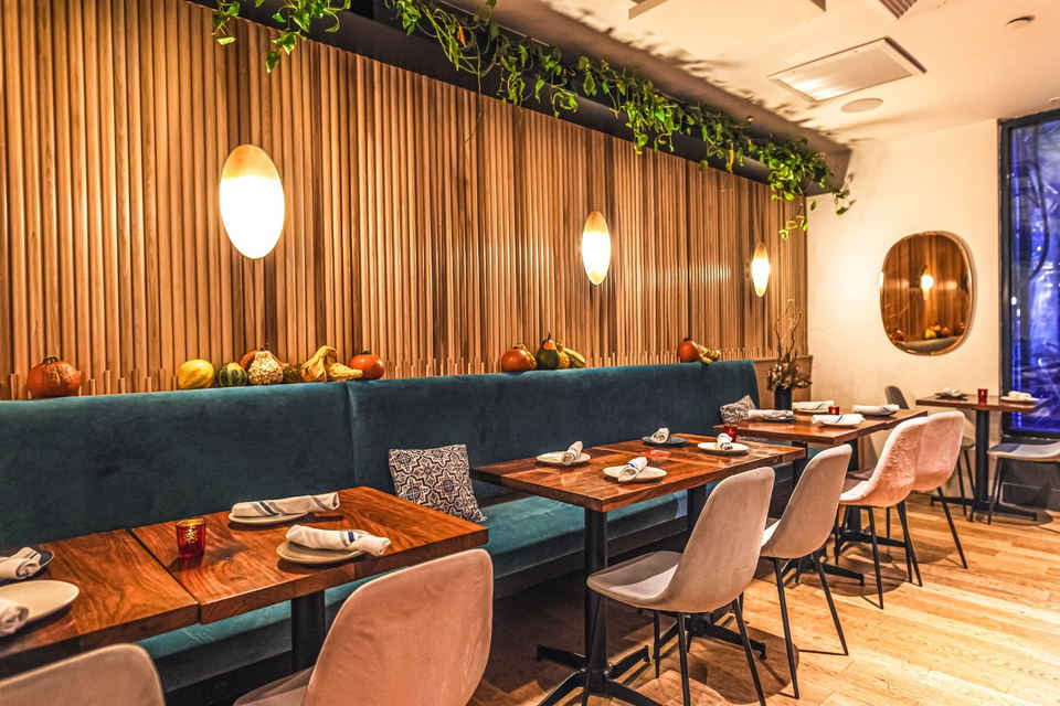 Ghemo (Upper West Side) features a prominent wall of vertical wooden slats.