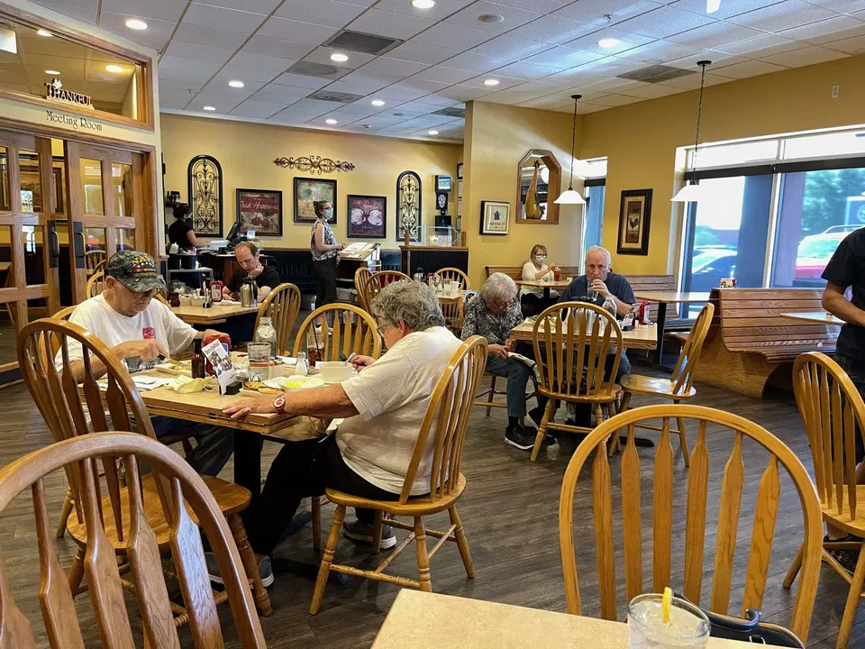 Sunnyside Up Cafe (Sunnyside) features a bright interior with warm yellow walls.