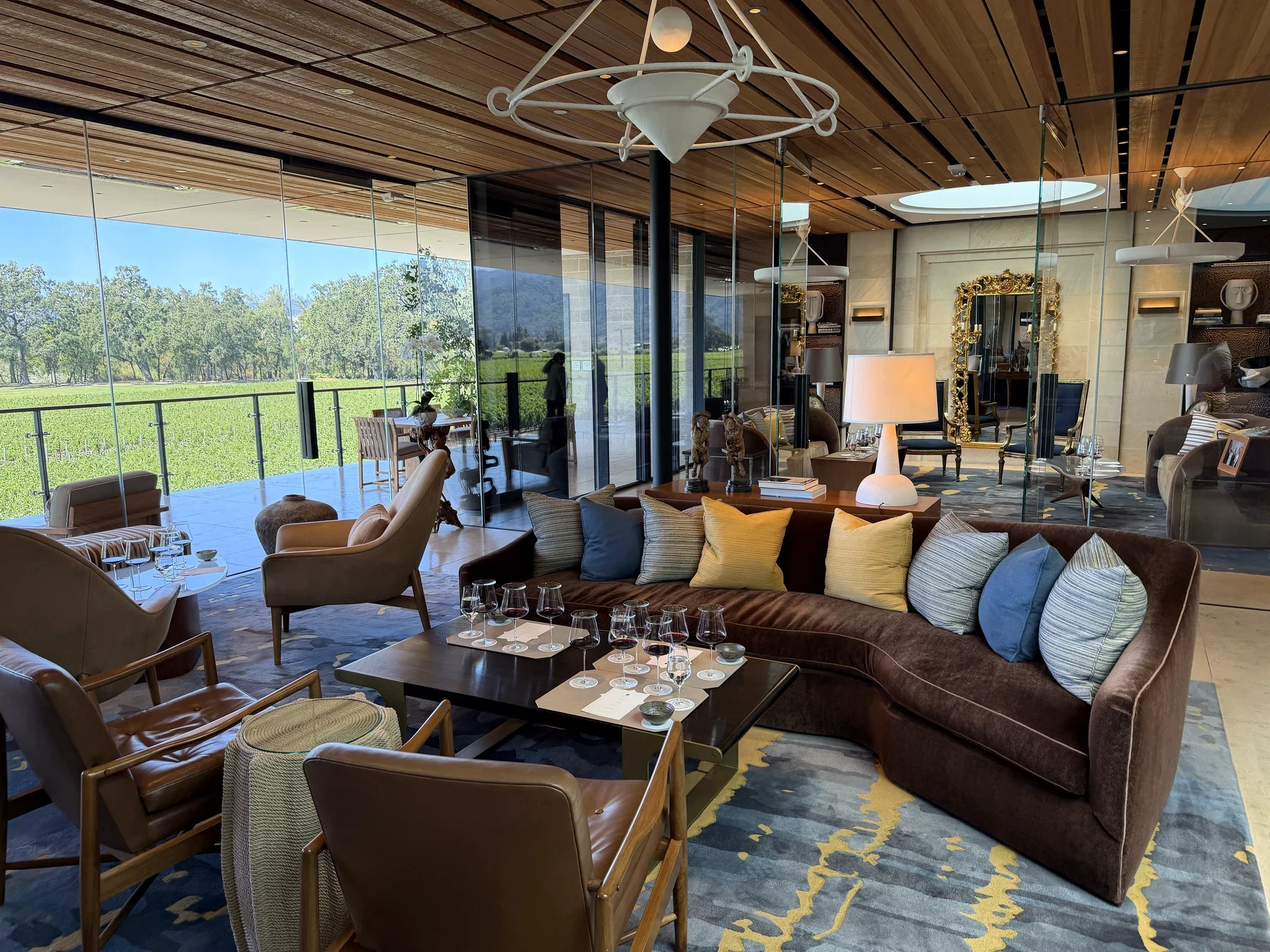 Opus One Partners' Room with tasting tables, art and glass walls opening to the estate vineyard