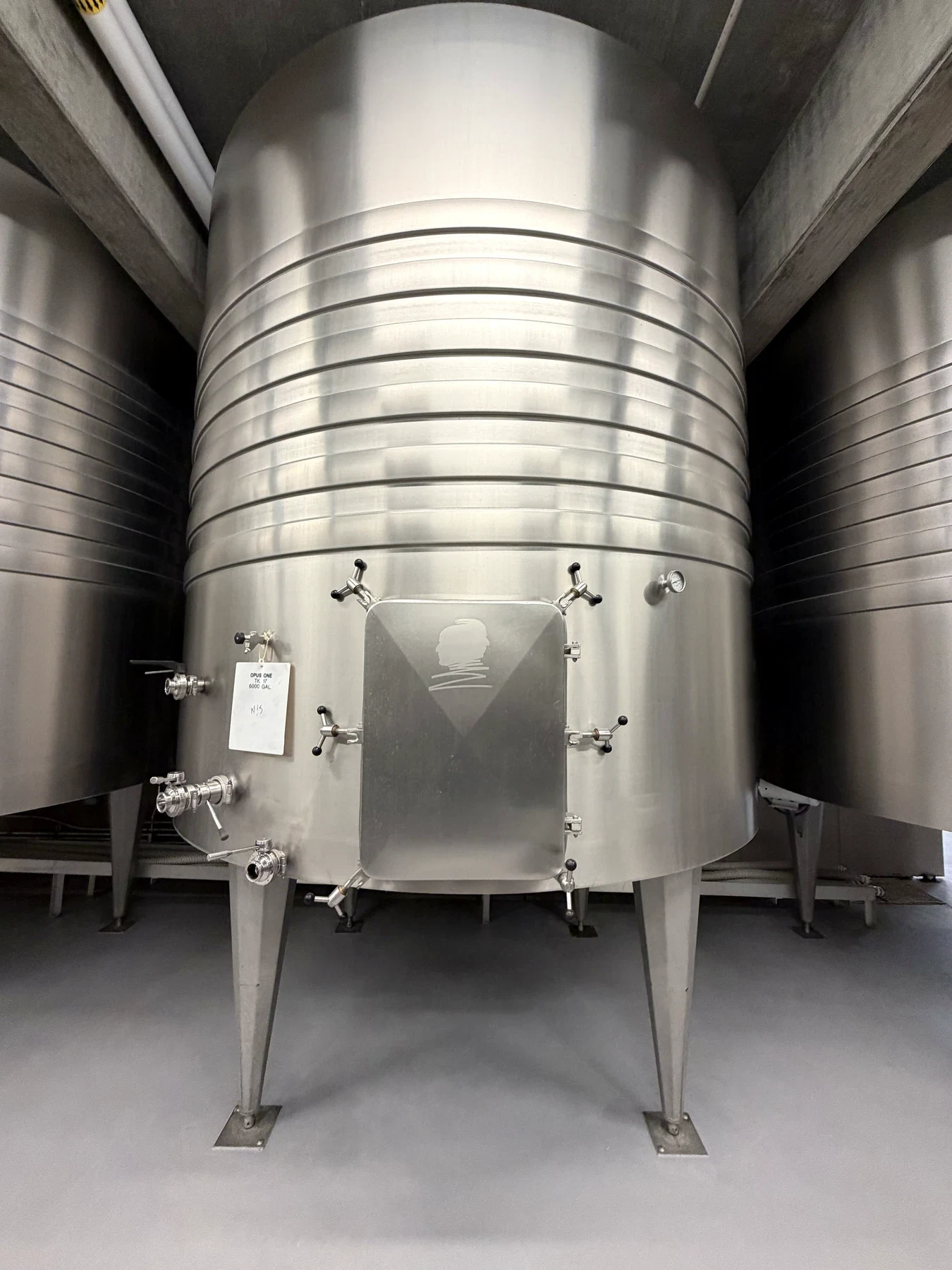 Large stainless-steel fermentation tank in the Opus One production cellar