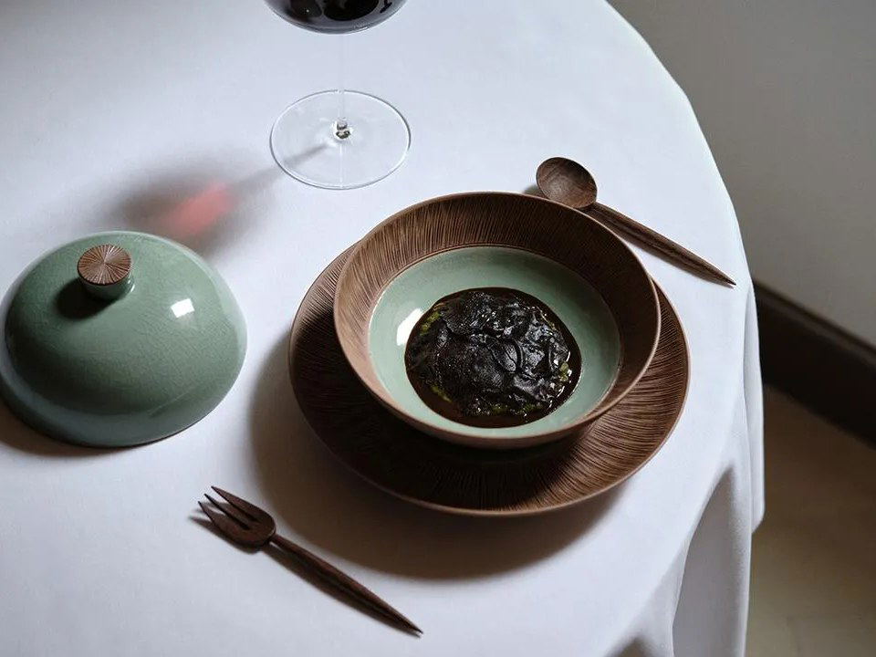 Oyatte's artfully plated vegetable dish, showcasing fermentation and preservation techniques.