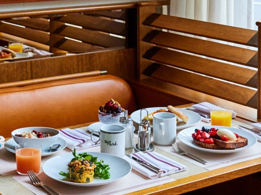Oyatte offers a delightful breakfast experience in a cozy booth setting.