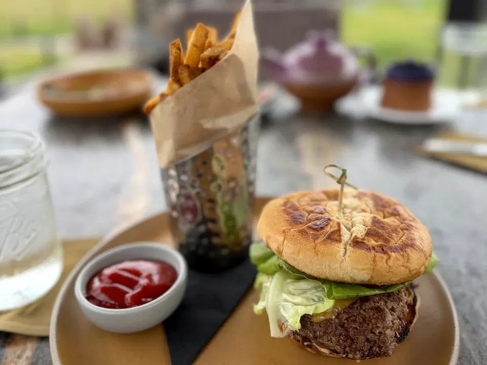 Wagyu smash burger and seasoned fries served during a Paws Up lunch