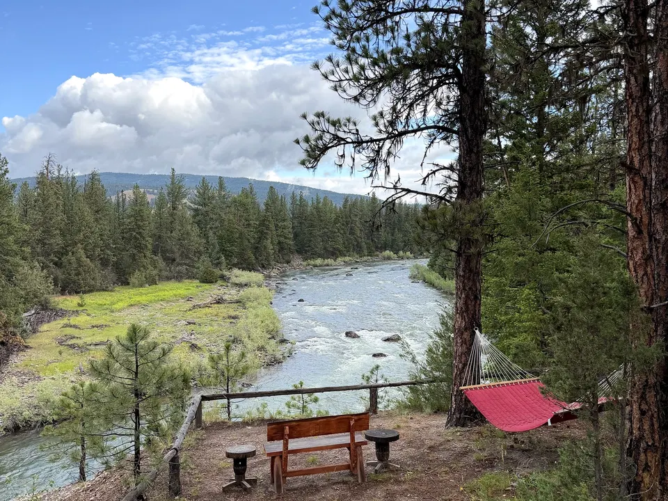 Blackfoot River, hammock, and bench viewed from Eagle's Nest at Cliffside Camp