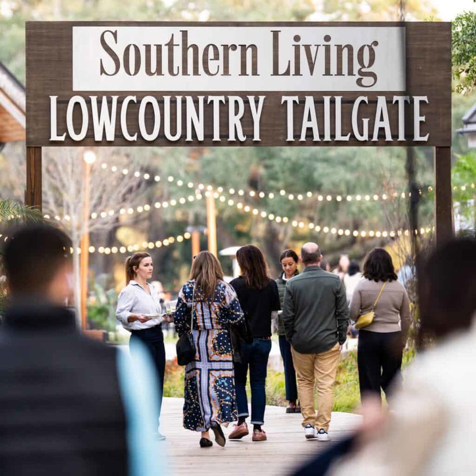 Guests walk beneath a Lowcountry Tailgate sign at the 2025 Charleston Classic