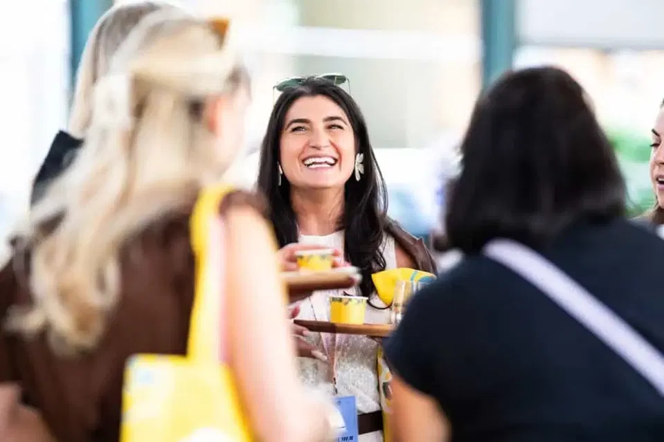 Guests converse with food and drinks at the 2025 Food and Wine Classic in Charleston