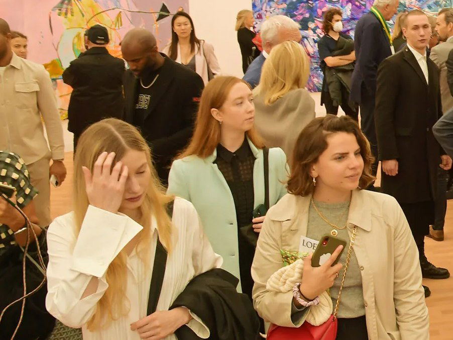 Frieze London's VIP preview buzzes with collectors and gallery directors amidst vibrant abstract art.