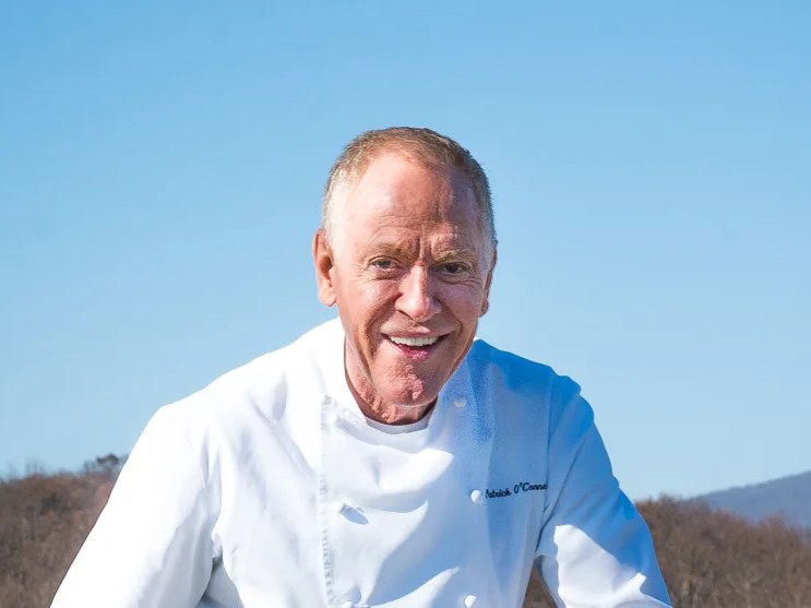 Chef Patrick O'Connell smiling in a white chef's coat