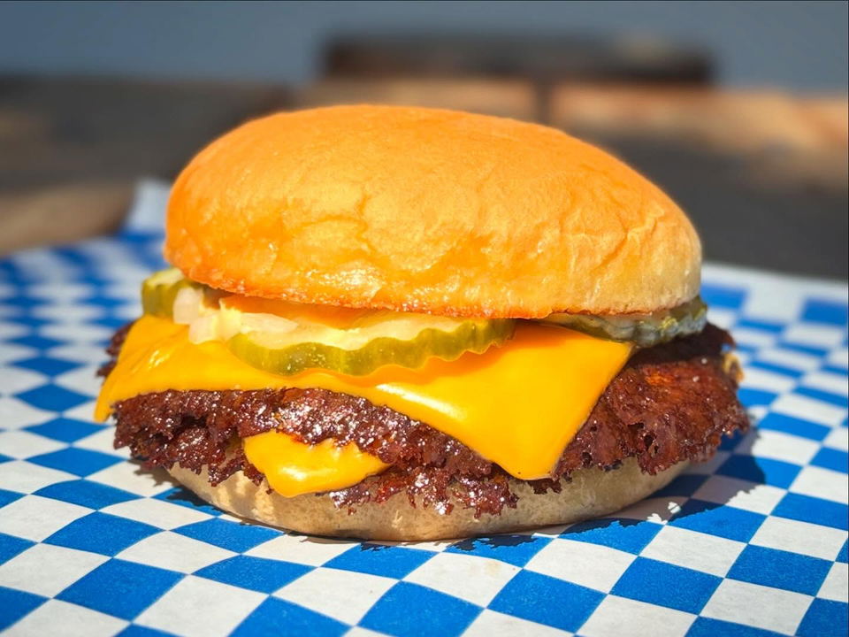 Sure Shot (Northeast Portland) serves its burger on classic blue and white checkered paper.
