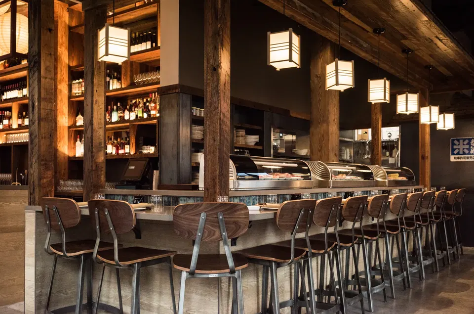 Sushi Fukami (Downtown Portland) features a row of distinctive square pendant lanterns illuminating the sushi bar.