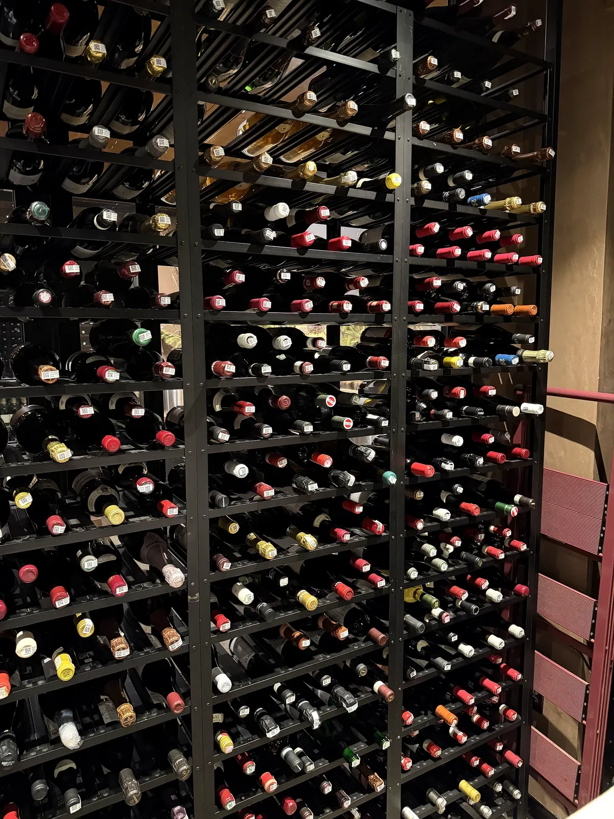 Floor-to-ceiling wine racks inside the PRESS Napa Valley cellar