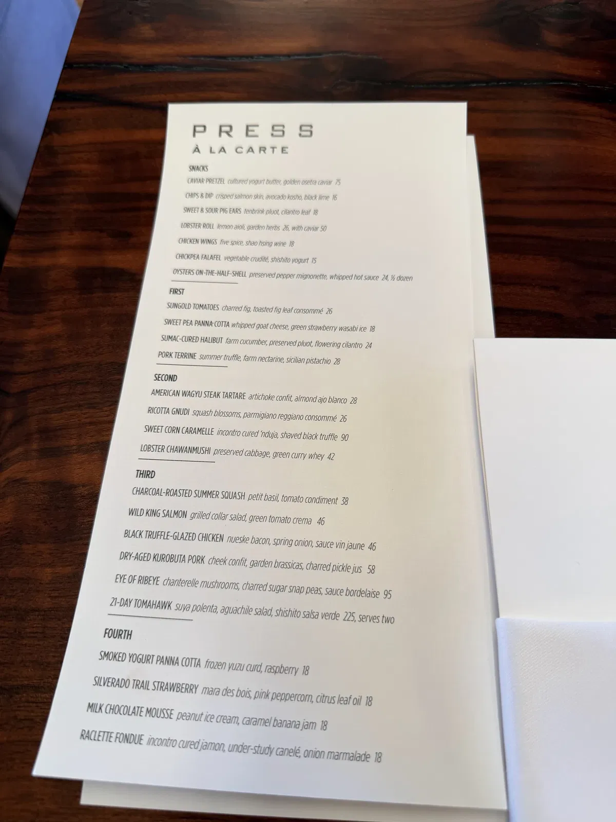 Printed à la carte dinner menu from PRESS Restaurant on August 11 2026
