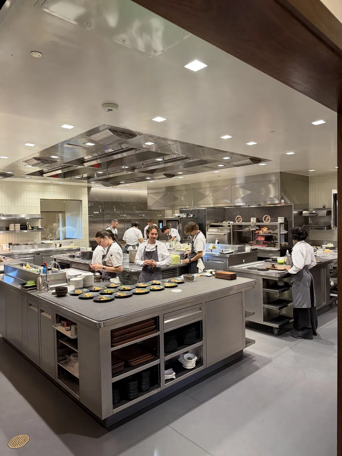 Philip Tessier's culinary team working in the open kitchen at PRESS