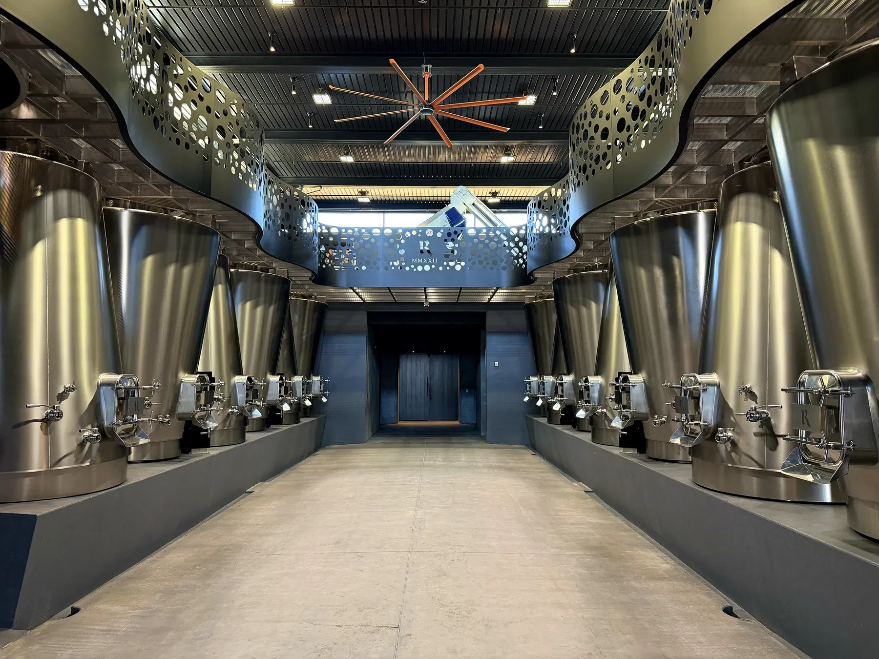 Symmetrical stainless-steel fermentation hall at Realm Houyi Estate