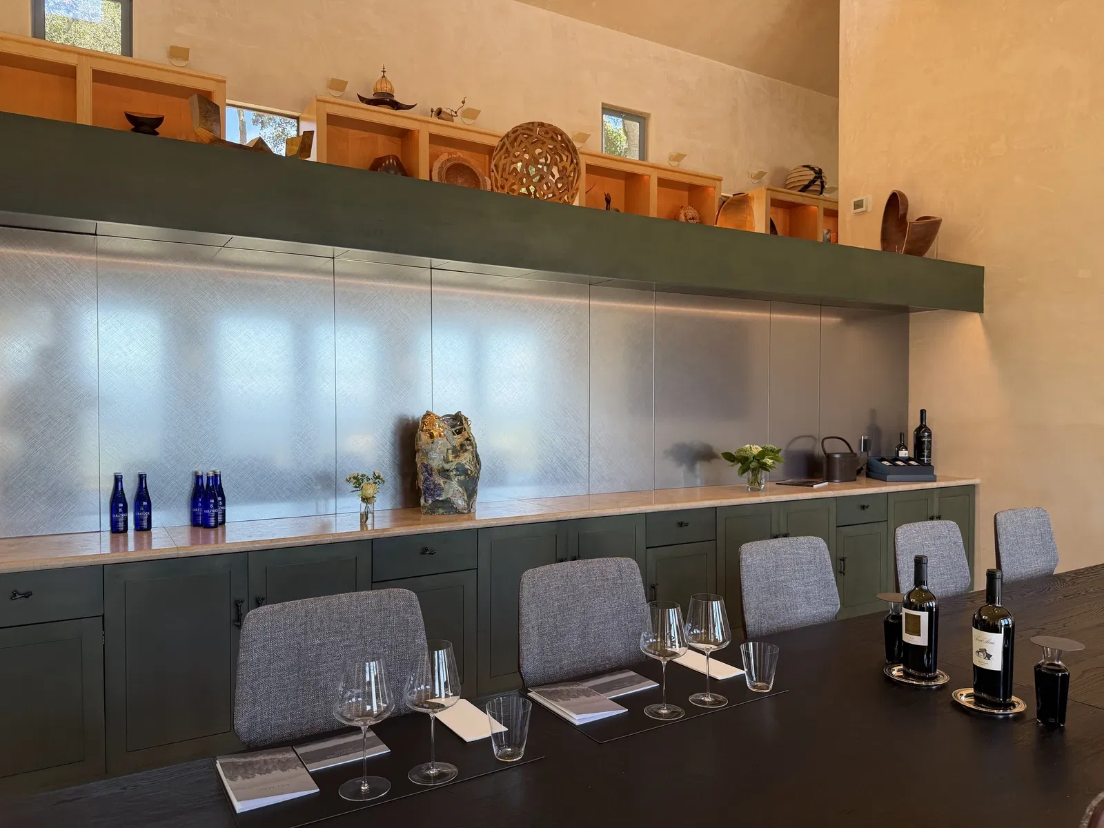 Long private tasting table in the art-filled Seven Stones Estate residence