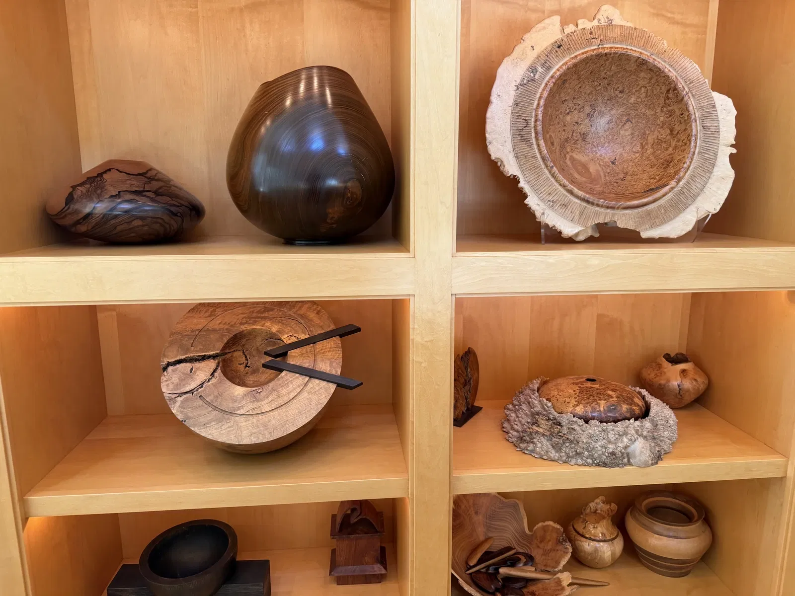 Shelves of sculptural wood and contemporary craft objects from the Wornick collection