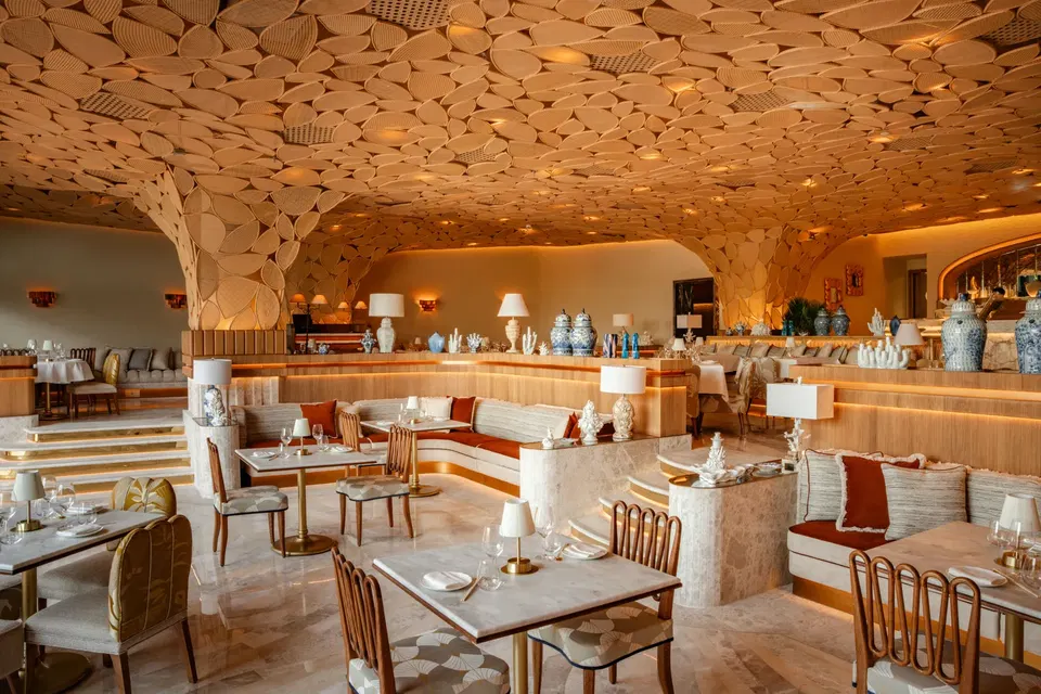 A striking ceiling of woven, circular patterns.
