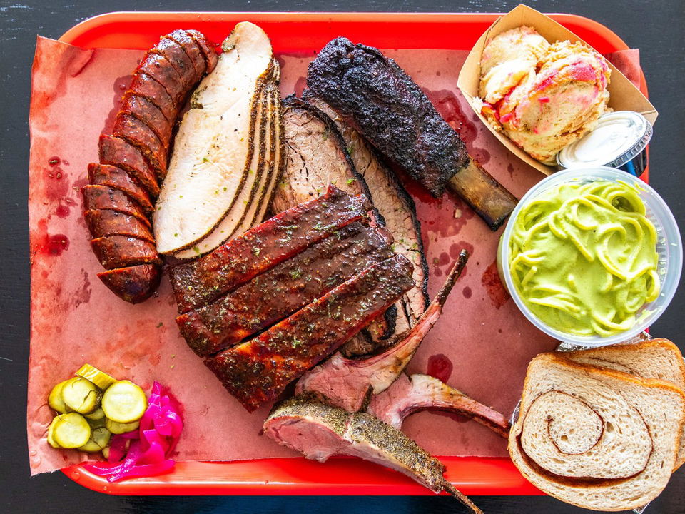 Kirbee's (Greenpoint) preview: A red tray loaded with Texas-style smoked meats and sides.