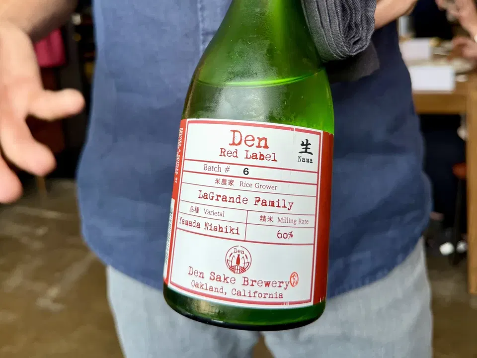 Den Sake Brewery Red Label Nama Batch 6 bottle from Oakland