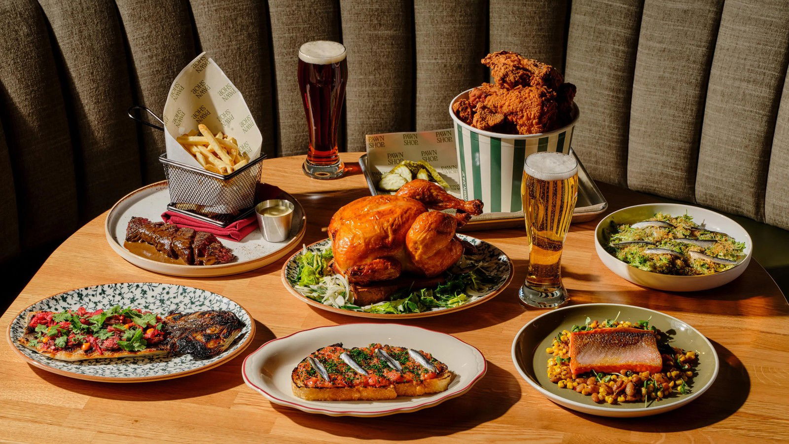 The Tasting Kitchen offers a feast of roasted chicken, fried chicken, fish, ribs, and fries with beer.