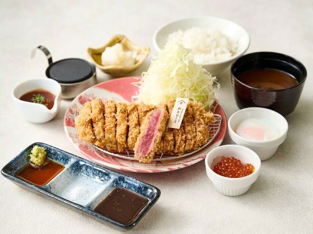 A Japanese katsu set meal, consistent with the Ten No Meshi experience, features a panko-crusted cutlet and ikura.