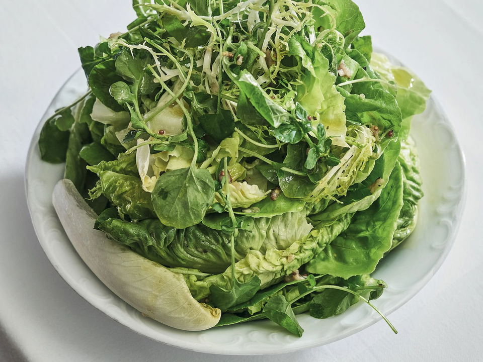 Via Carota's signature insalata verde, a towering mix of fresh greens.