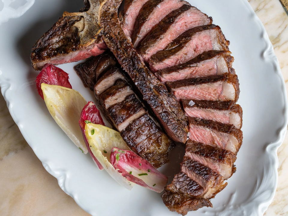 Gwen Hollywood: A perfectly sliced porterhouse steak, medium-rare, with grilled radicchio and endive.