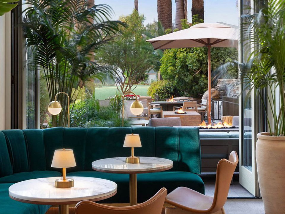 Soko at Fairmont Miramar Santa Monica offers an elegant setting with lush outdoor views and cozy fire features.