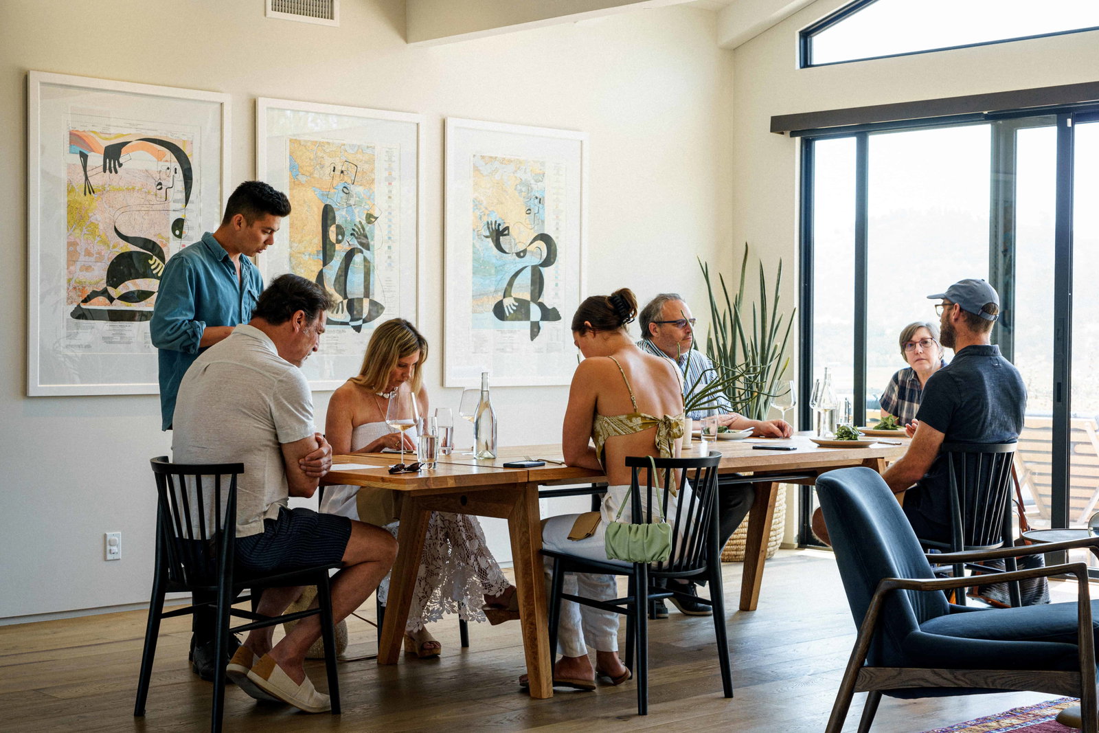 Tyler Winery is bathed in natural light from expansive windows, creating a bright and airy ambiance.