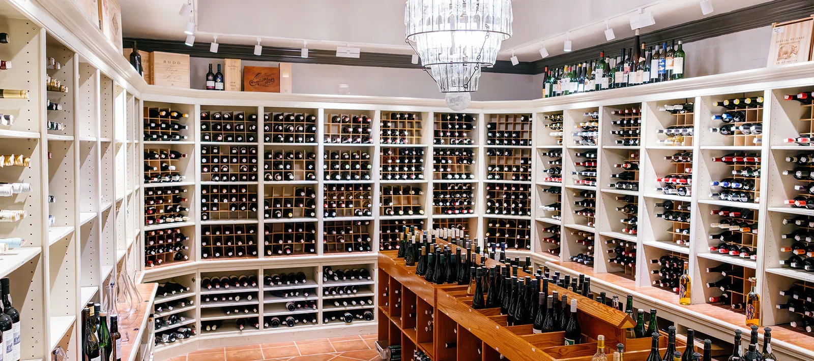 Wine Program and Sommelier Service features an impressive, extensive collection of bottles on display.