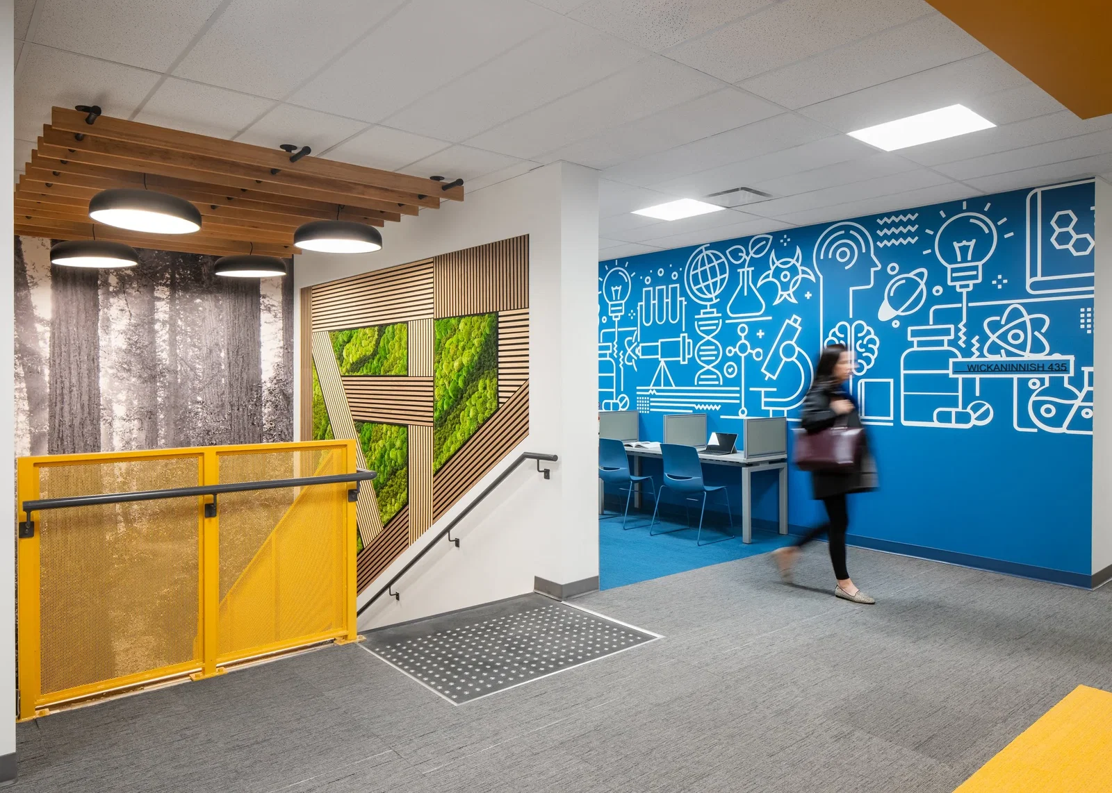 Awards and Customer Feedback features a striking blue wall adorned with white scientific illustrations.
